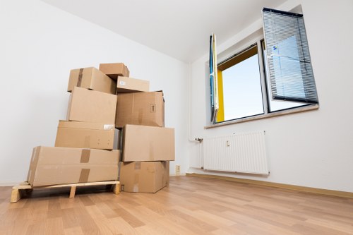 Professional movers handling office furniture during relocation