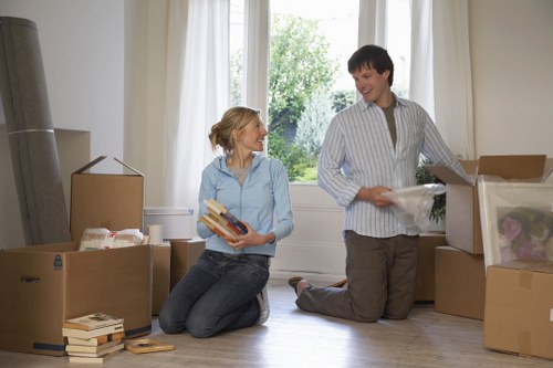 Professional movers loading furniture for same day removals