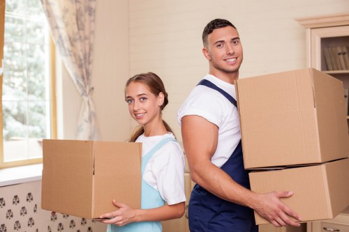 Trained movers handling furniture carefully during a Bayswater move