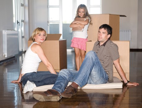 Local movers handling boxes and furniture in a Bayswater apartment building